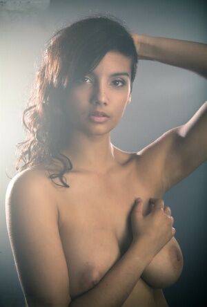 Beautiful Desi female removes her dress to expose her big natural boobs on picsofsex.com