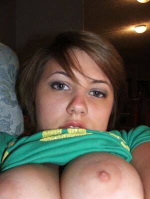 Young looking amateur takes self shots of her big natural boobs on picsofsex.com