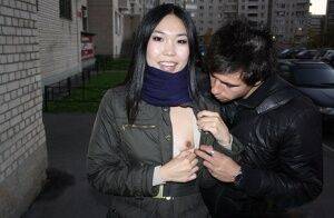 Asian girl Yiki gets involved in MMF sex in an alley with big cocks on picsofsex.com