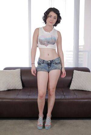 Amateur chick Cadence Carter posing in denim shorts for casting couch on picsofsex.com