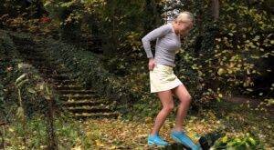 Cute blonde Victoria Pure hikes her skirt to take a pee along country lane on picsofsex.com