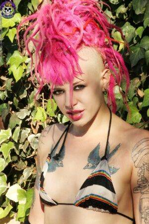 Pink haired tattooed punk girl by the pool on picsofsex.com