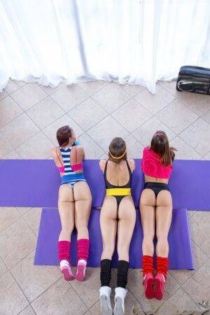 Three dykes in legs warmers and tights eat ass and pussy after a yoga session on picsofsex.com