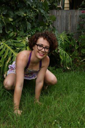 Geeky girl Rosie wears her glasses for her nude debut on the back lawn on picsofsex.com