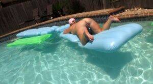 Fat amateur Dee Siren masturbates on an air mattress in a swimming pool on picsofsex.com