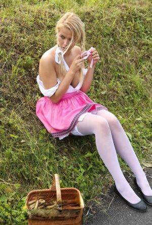 Cute blonde teen Nikki Dream hikes her skirt to masturbate in the countryside on picsofsex.com