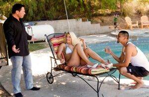 Hot blonde Britney Amber sports red lips while having sex next to a pool on picsofsex.com