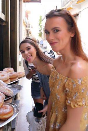 Leggy girls stumble across a donut stand while doing touristy things on picsofsex.com