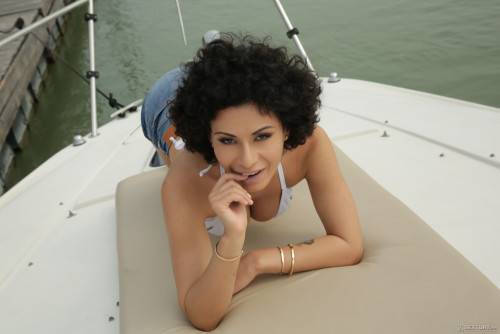 Curly-haired Beauty With Big Natural Tits Gets Sodomized On Yacht on picsofsex.com