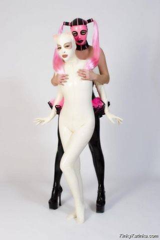 Two babes wearing kinky latex outfits on picsofsex.com