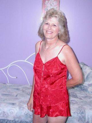 Classy granny in sexy red lingerie spreads hairy pussy on cam on picsofsex.com