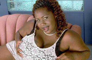 Ebony bbw getting naked and showing off her massive boobs on picsofsex.com