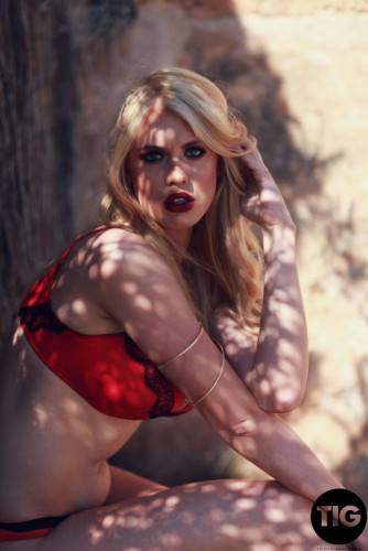 Kristy Leonie Strips Nude From Red Lingerie on picsofsex.com