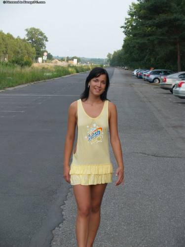 Luscious brunette young Stephanie in sexy skirt exhibits her ass outdoor on picsofsex.com