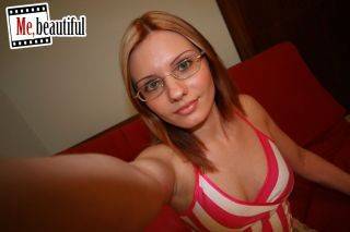 Hottie in glasses takes nasty photos of her bubbies and spread twat on picsofsex.com