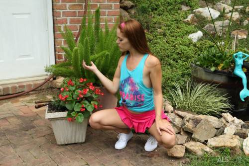 Hot redhead teen Kymberly Brix in sexy skirt exhibits tiny tits and toys her cunt outdoor on picsofsex.com