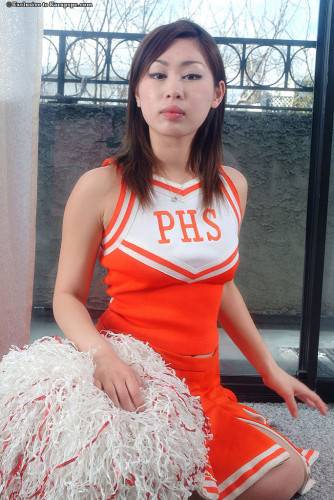 Gracile asian brunette youthful Yumi in uniform reveals tiny tits and hairy pussy on picsofsex.com