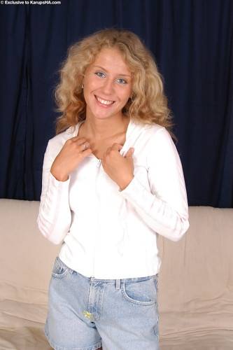 Sylphlike blond teen Lita in fancy shorts revealing her butt and vagina on picsofsex.com