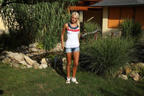 Shaved And Tanned Blonde Ivana Sugar Poses Outside And Shows Us Her Delicate Snatch on picsofsex.com