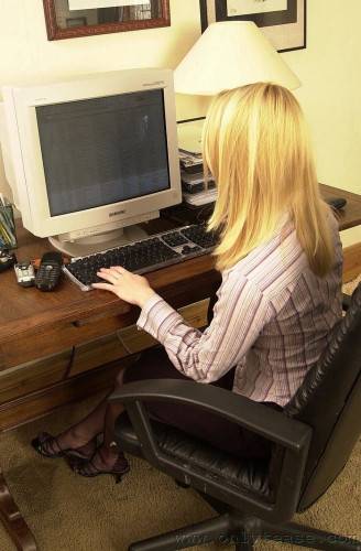 Blonde Haired Office Lady Abigail Strips And Proves That She Looks Fine In Nylons And Garters on picsofsex.com