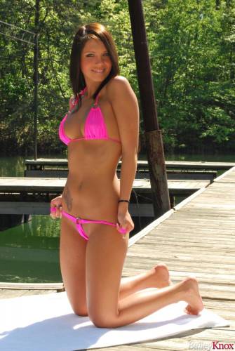 Sexy Looking Dark Haired Girl Bailey Knox Takes Her Pink Swim Suit Off During Her Outdoor Posing on picsofsex.com