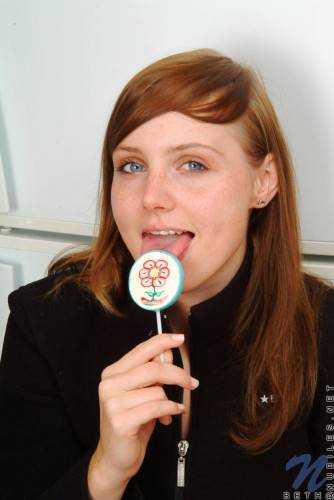 Red Haired Teen Babe Beth Nubiles Slowly Strips While Eating A Lollipop. on picsofsex.com