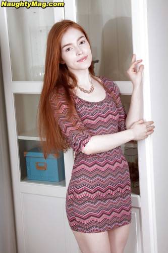 Sexy red-haired cutie Jia Lissa in fancy skirt unveiling small tits and nice pussy on picsofsex.com