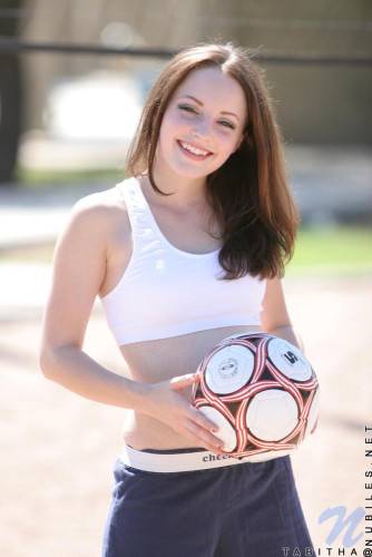 Smiling Sportive Girl Tabitha Nubiles In Snow White Top And Blue Shorts Poses With A Ball Outside on picsofsex.com