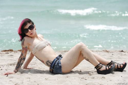 Hot american cutie Joanna Angel uncovering small tits and sexy butt on the beach - Usa on picsofsex.com