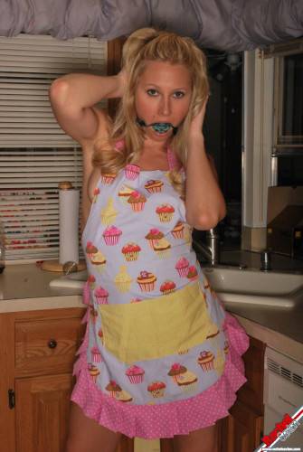 Gagged Bimbo Rachel Sexton Is Fooling Around In Dress And Half Nude In The Kitchen on picsofsex.com