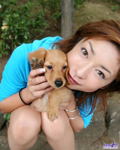 Posing With A Dog Is What One Of The Best Asian Babes Nao Idols Loves To Do. on picsofsex.com