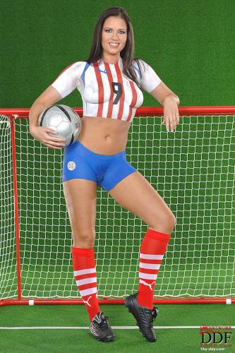 European Babe Veronica Da Souza In Painted Soccer Uniform Poses With A Ball on picsofsex.com