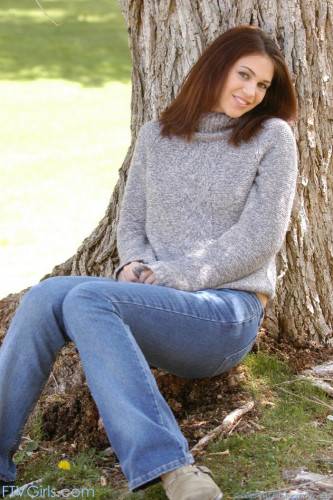 Attractive Brunette Faith Leon Pulls Down Her Jeans And Shows Her Juicy Snatch Near The Tree on picsofsex.com