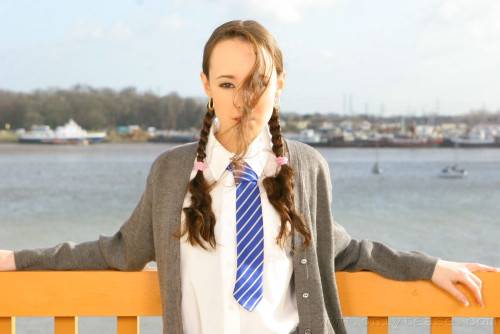 Flat Chested Schoolgirl Laura J In Pigtails Does Strip Tease On Balcony on picsofsex.com