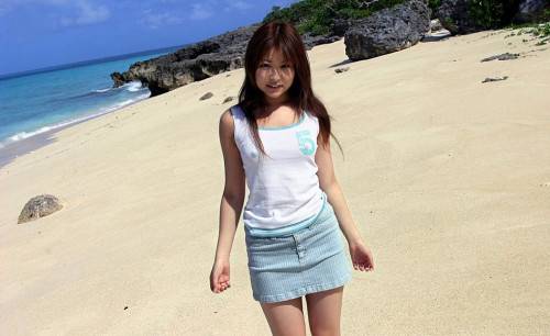 Girl Miyu Sugiura Is On The Beach Showing Off The Delicious Looking Thong Up The Skirt on picsofsex.com