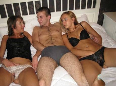 Three step-siblings embark on a taboo threesome on their parent's bed on picsofsex.com