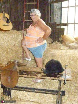 Granny frolics in the hay on picsofsex.com