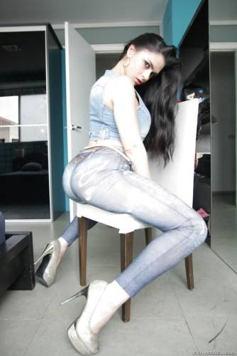 Charming latin brunette Marta La Croft in jeans revealing big tits and sexy ass on picsofsex.com