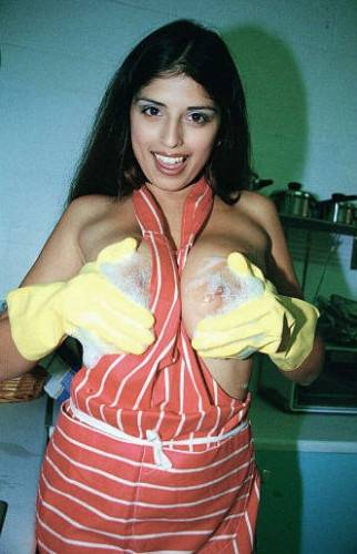 Naughty Housewife Kerry Marie In Yellow Gloves Demonstrates Her Huge Jugs And Twat on picsofsex.com