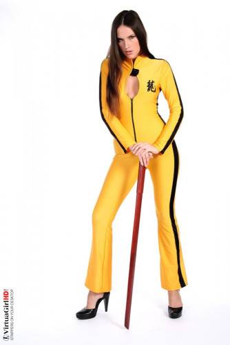 Deny Is Such A Hot Brunette, Dressed In A Kill-bill Style Yellow Suit Looking Sexy. on picsofsex.com