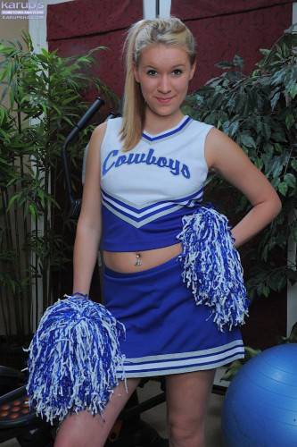 Cheerleader Kristi Kay Takes Off Her Blue Uniform And Displays Her Smooth Pink Pussy on picsofsex.com