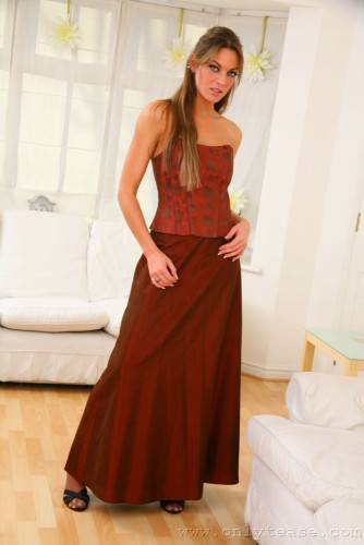 Fascinating Ali C Has Stockings And Garters Under Her Stylish Red Evening Gown on picsofsex.com