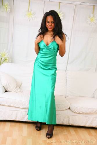 Frisky Black Honey Olivia B Does Some Posing In Long Green Evening Dress And Without It on picsofsex.com