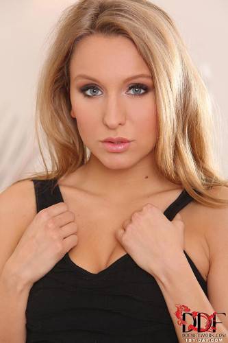 Cute Blonde Teen Nessy Wild Is About To Take Her Black Dress Off And Pose. on picsofsex.com