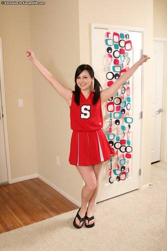 Skinny Flat Chested Kitty Ashli Orion Strips Out Of Her Red And White Uniform on picsofsex.com