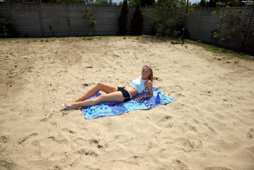 Blonde Babe Angel Snow Is Lying On The Beach Uncovering The View On The Shaved Beaver on picsofsex.com