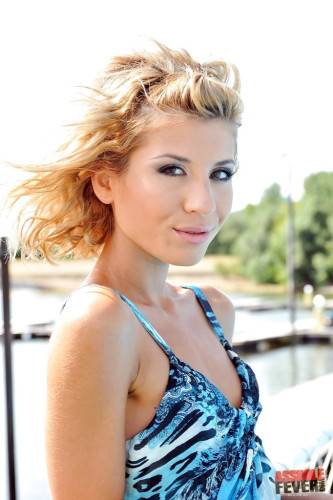 Foxy babe Ioana denudes small tits and cute pussy at pool on picsofsex.com