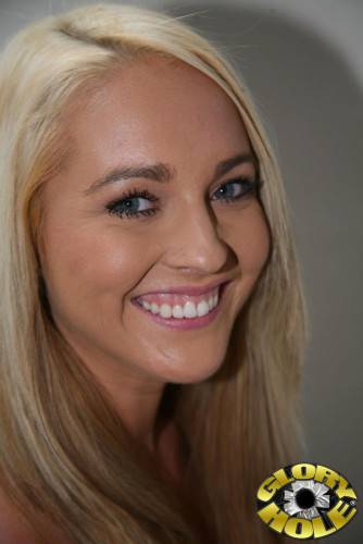 Pretty Blonde Ashley Stone Is Smiling Into Camera And Showing Mouth Filled With Jizz Of Two Rods on picsofsex.com