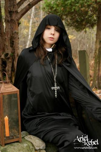 Naughty Teenage Nun Ariel Rebel Dressed In Black Flashes Her Bald Pussy Outdoors on picsofsex.com