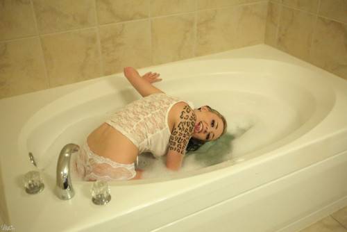 Aroused Passionate Lily Xo Poses In The Bath Tub And Teases With Pleasure on picsofsex.com